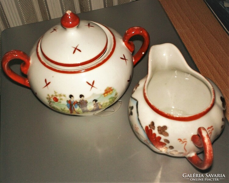 Oriental porcelain sugar holder and pouring in a pair