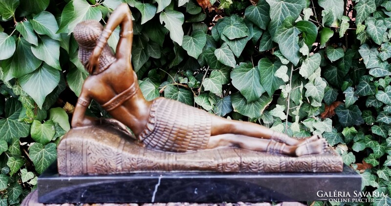 Cleopatra resting on a sofa - bronze statue