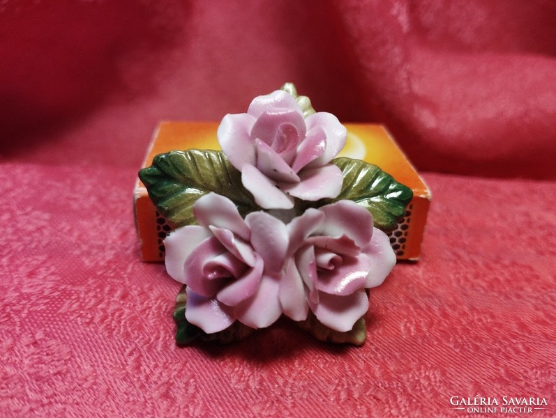 Beautiful porcelain brooch with hand-shaped roses