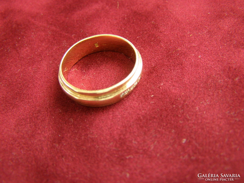 Women's gold stone wedding ring with 5 small diamonds