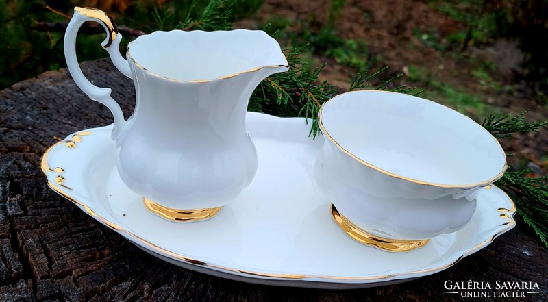 Elegant white and gold royal albert val' dor milk pourer on a small sugar tray