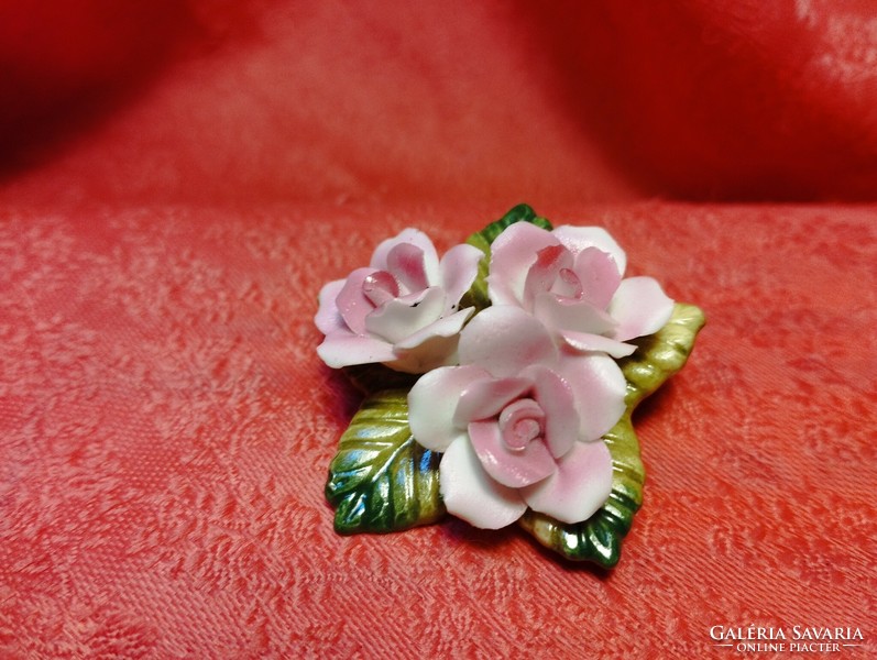 Beautiful porcelain brooch with hand-shaped roses