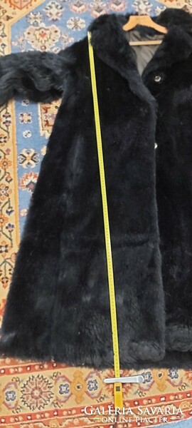 Black women's faux fur coat, slightly expanding downwards, photo