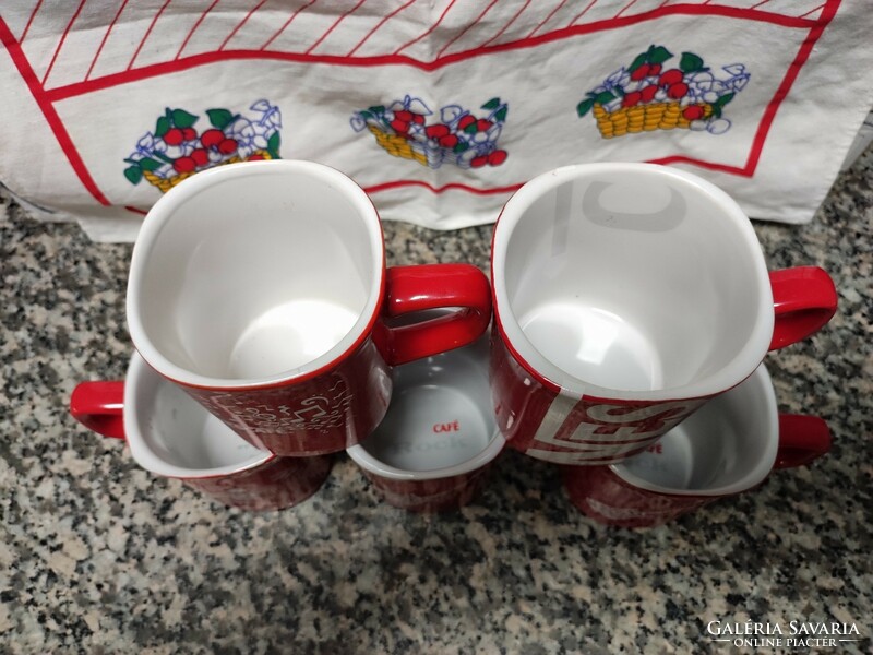 Red coffee mugs with Nescafé inscription