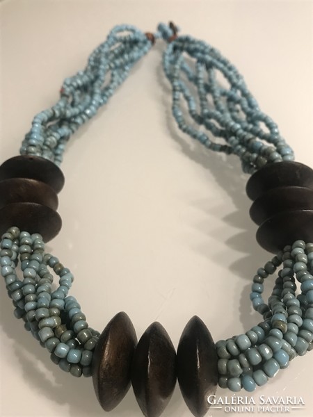 Necklace made of turquoise beads and exotic wooden discs