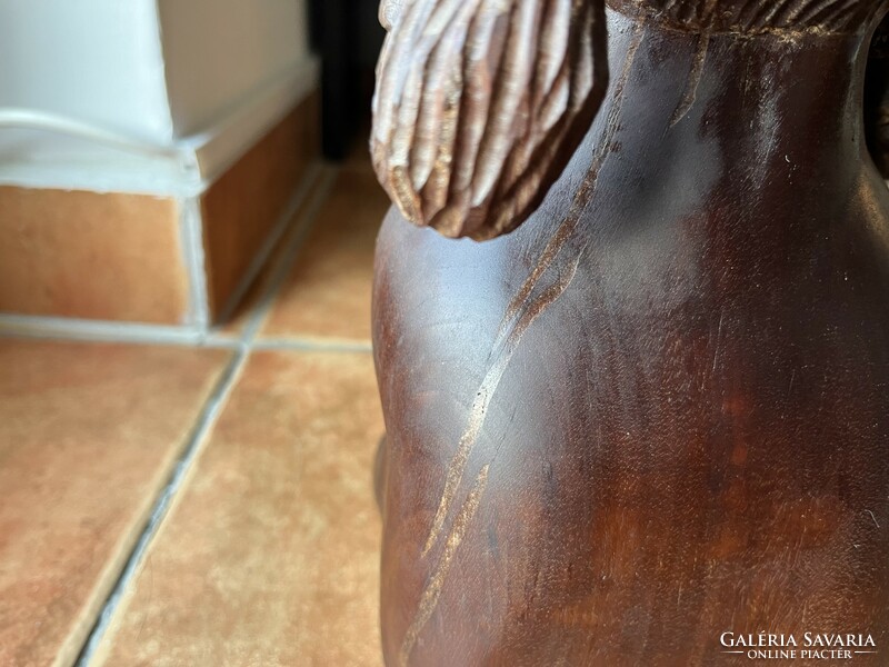 A marked hardwood sculpture depicting an Aboriginal woman