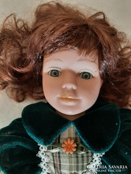 A 40cm doll with a beautiful face, porcelain head, hands and feet