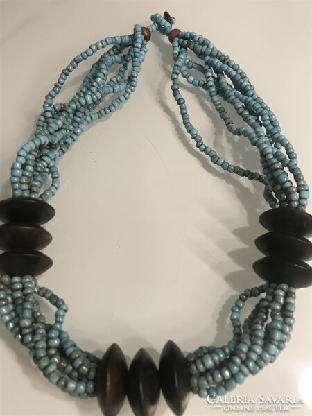 Necklace made of turquoise beads and exotic wooden discs