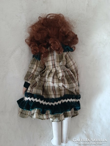 A 40cm doll with a beautiful face, porcelain head, hands and feet