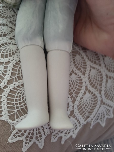 A 40cm doll with a beautiful face, porcelain head, hands and feet
