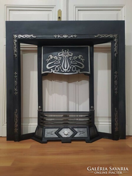 Cast iron fireplace frame for sale.