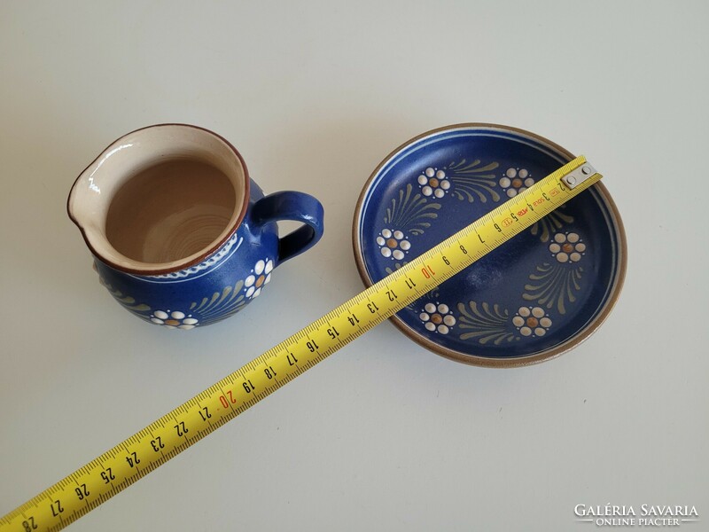 Folk ceramic cream pouring jug with blue flowers