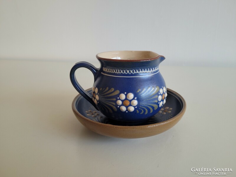 Folk ceramic cream pouring jug with blue flowers
