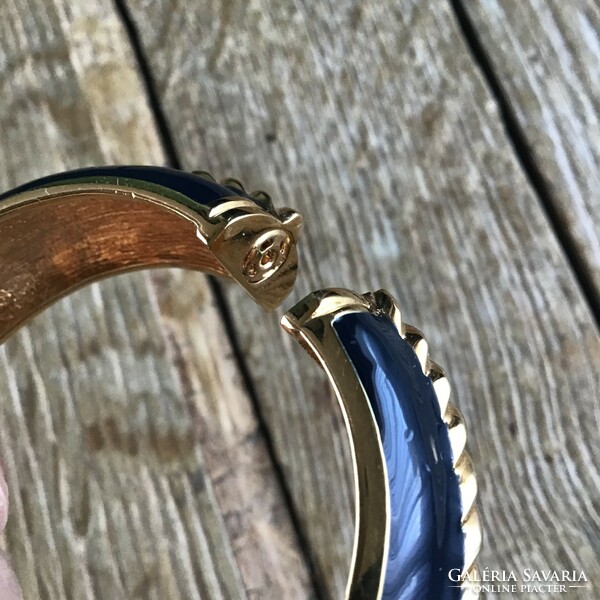 Older st john black gold colored bracelet with dark blue fire enamel