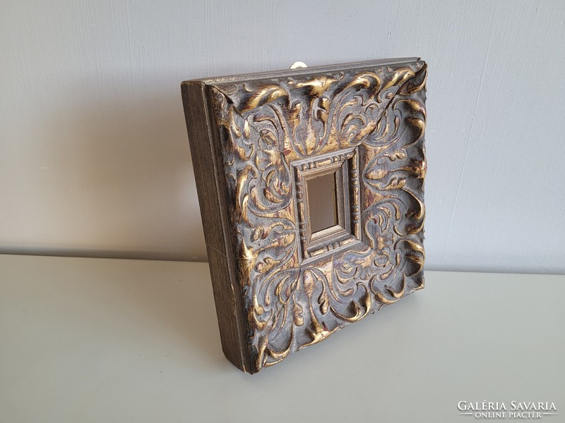 A thick picture frame for a small-sized work