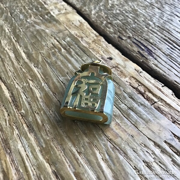 Ancient oriental carved mineral pendant