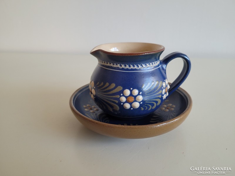 Folk ceramic cream pouring jug with blue flowers