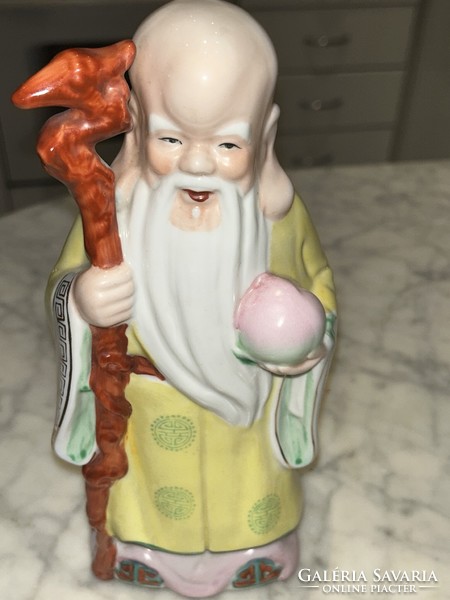 Oriental priest porcelain statue