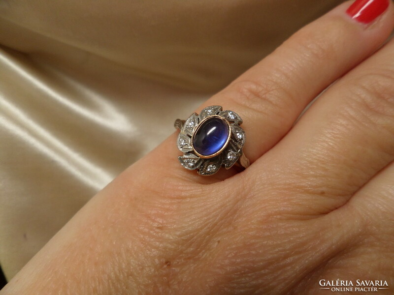 Antique gold crammed ring with synthetic sapphire and brills