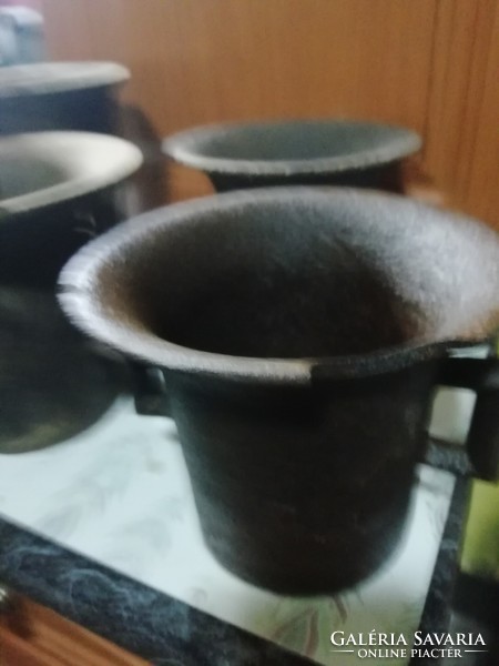 Antique iron mortars are in the condition shown in the pictures