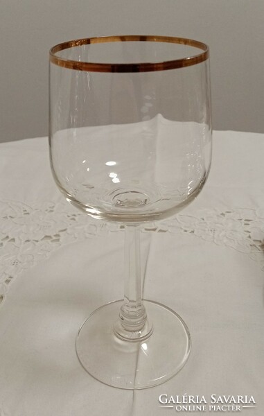 Gold-rimmed wine and champagne glass