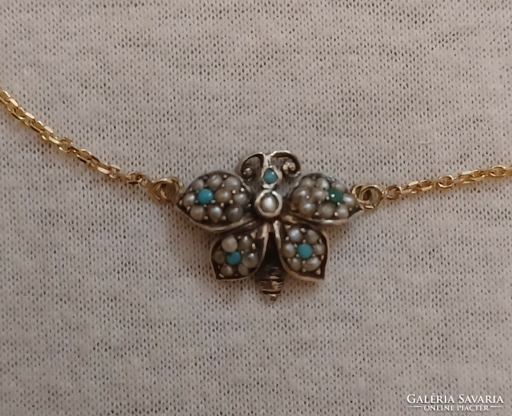 Antique gold and silver necklaces studded with turquoise and pearls