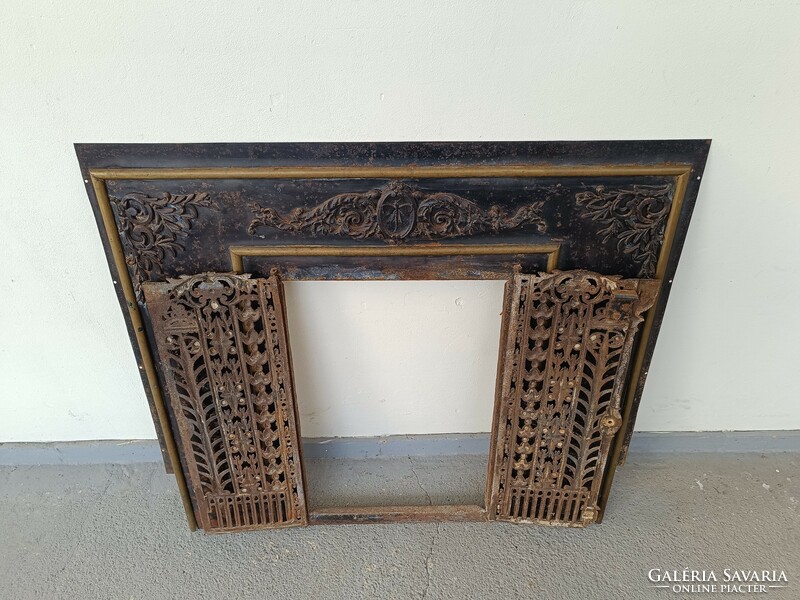 Antique metal overlay stove fireplace with cast iron door frame 8165