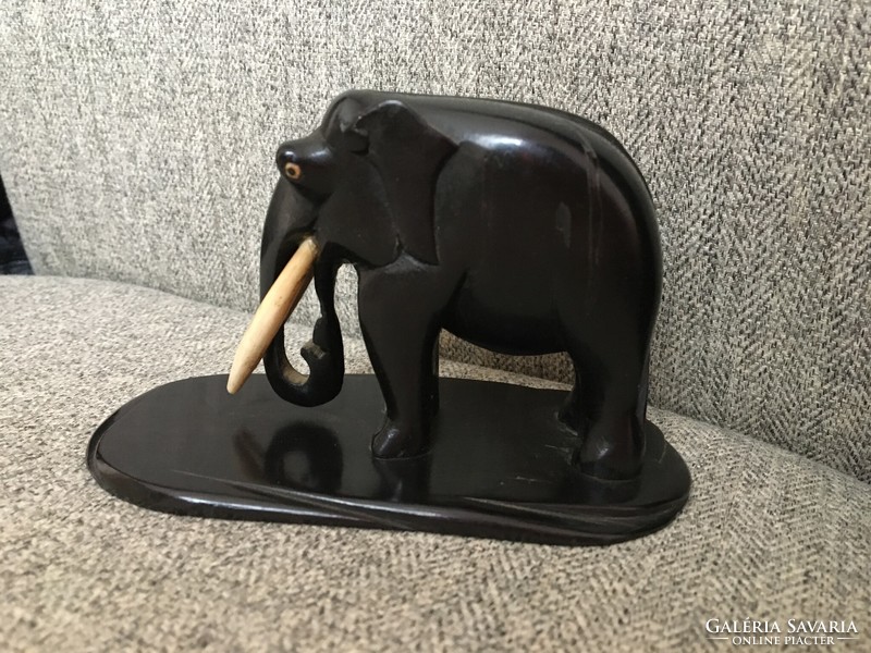 Antique elephant with ebony and bone tusks