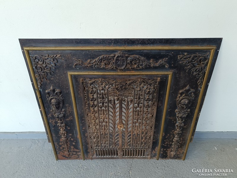 Antique metal overlay stove fireplace with cast iron door frame 8165