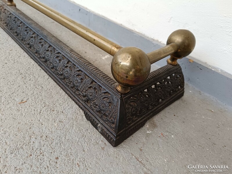 Antique cast iron and brass stove in front of fireplace 900 8373