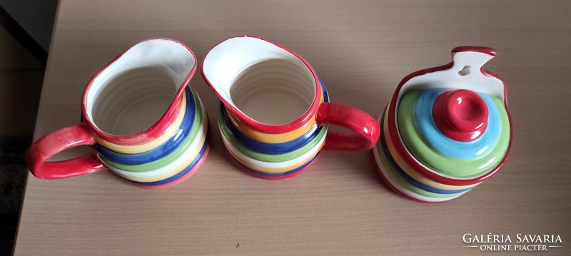 Very showy, cheerful colorful ceramic jugs and salt or sugar holder