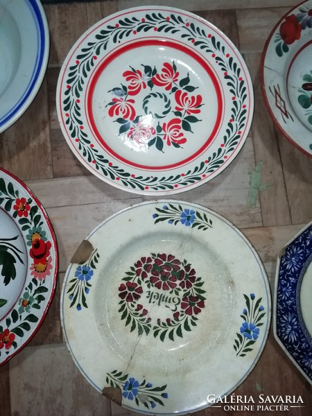 The pieces shown in the pictures from the collection of folk plates are all damaged here and there