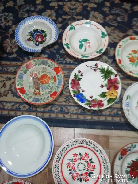 The pieces shown in the pictures from the collection of folk plates are all damaged here and there