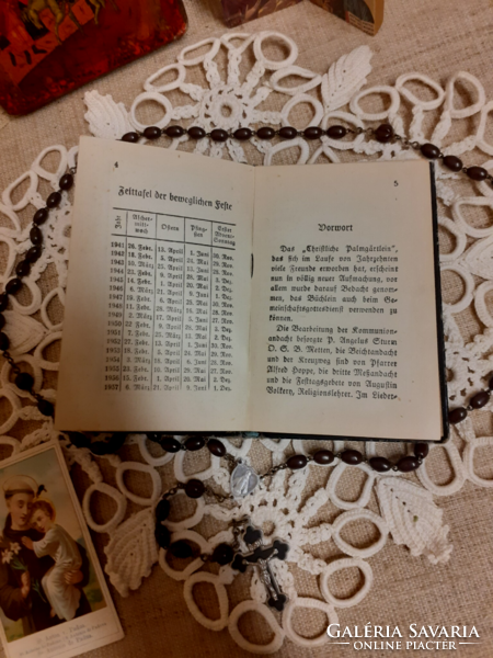 Old German language prayer book s:m.Goretti medallion on chain icon openable altar rosary on tablecloth together