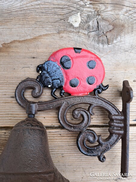Pigeon bell with cast iron ladybird, door decoration
