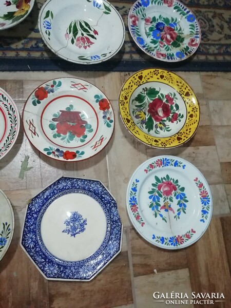 The pieces shown in the pictures from the collection of folk plates are all damaged here and there