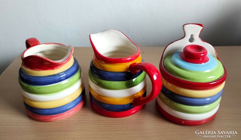 Very showy, cheerful colorful ceramic jugs and salt or sugar holder