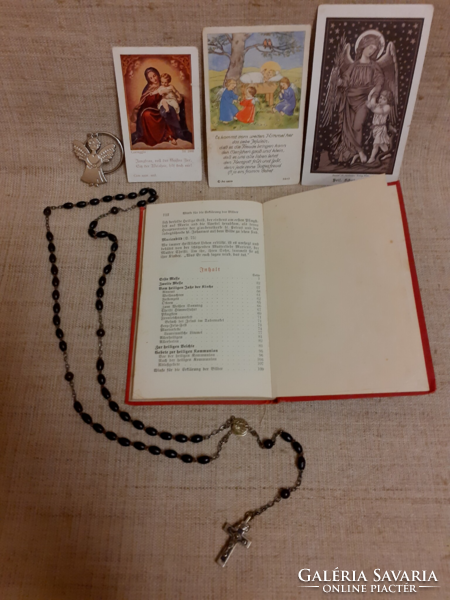 Old German-language scott's measurement book for the smallest children with a rosary at Mass