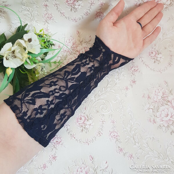 New, custom-made, dark blue lace gloves that can be hung on the finger