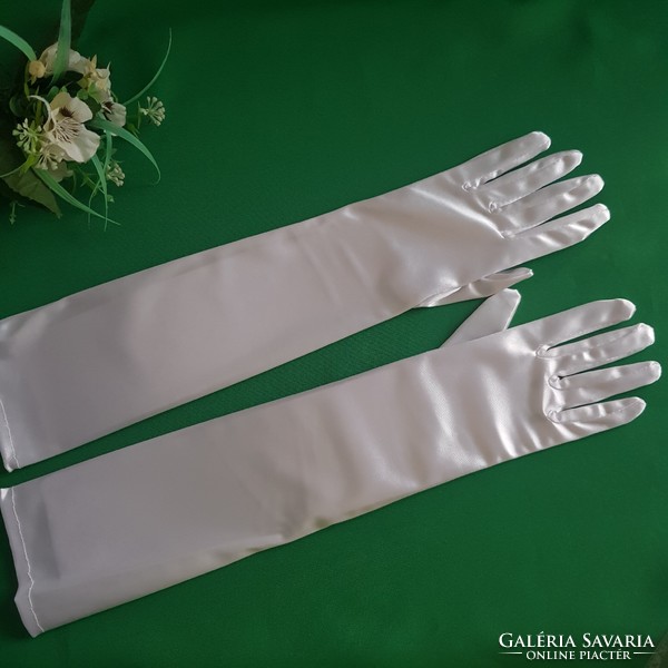 New, elbow-length, snow-white prom, bridal satin gloves