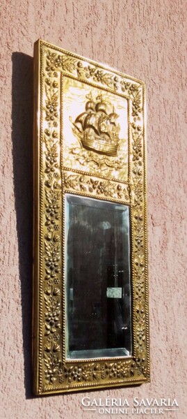 A bronze framed wall mirror decorated with nautical and floral motifs, a unique rarity