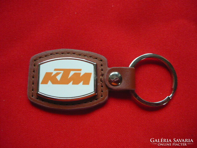 KTM metal key ring on a leather base