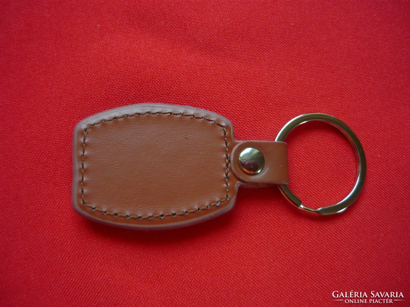 KTM metal key ring on a leather base