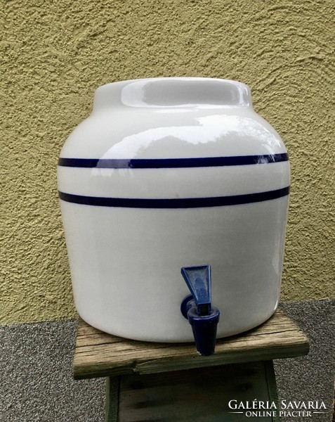 A huge porcelain vessel with a tap