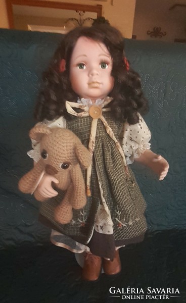 Porcelain doll with teddy bear, stand