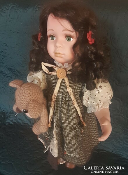 Porcelain doll with teddy bear, stand