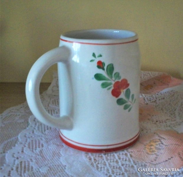 A popular hand-painted floral pitcher as well as a vase