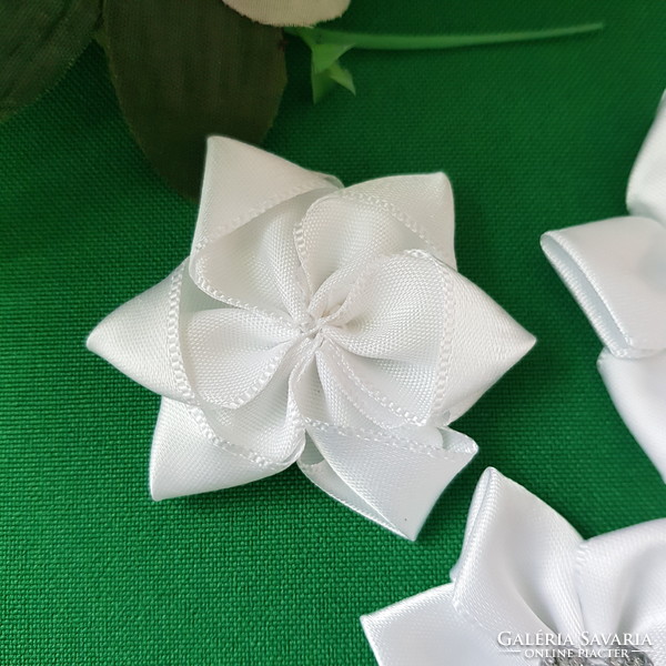 Snow-white satin flower with a heart-shaped, sparkling decoration