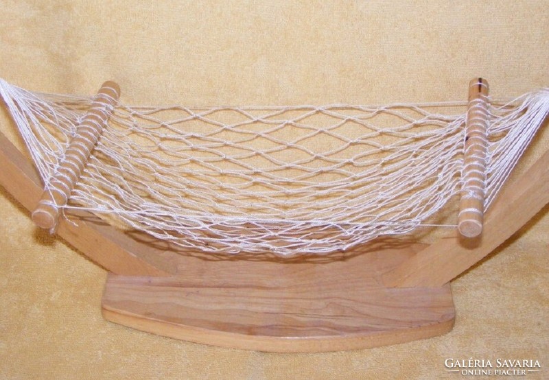 Wooden rocking bed for a toy doll