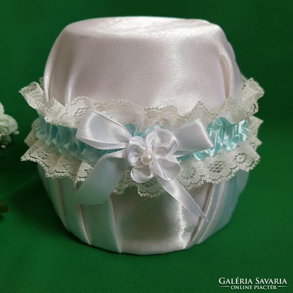 Bridal garter with snow-white lace, white bows and flowers, thigh lace